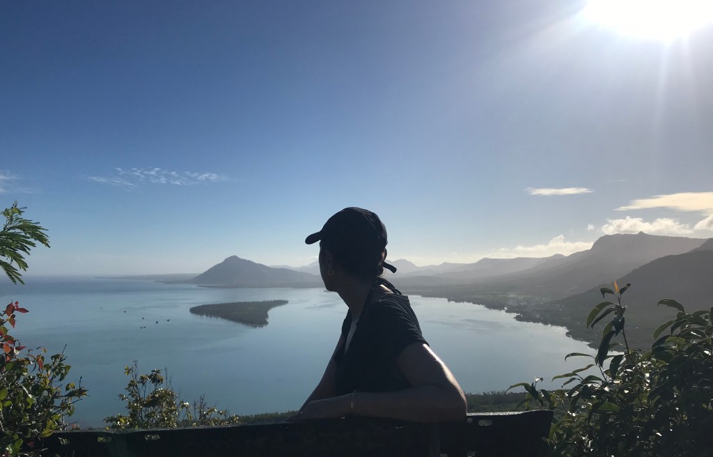 a person looking back, illustrating reflection on personal health journey to share wisdom learnt from it.